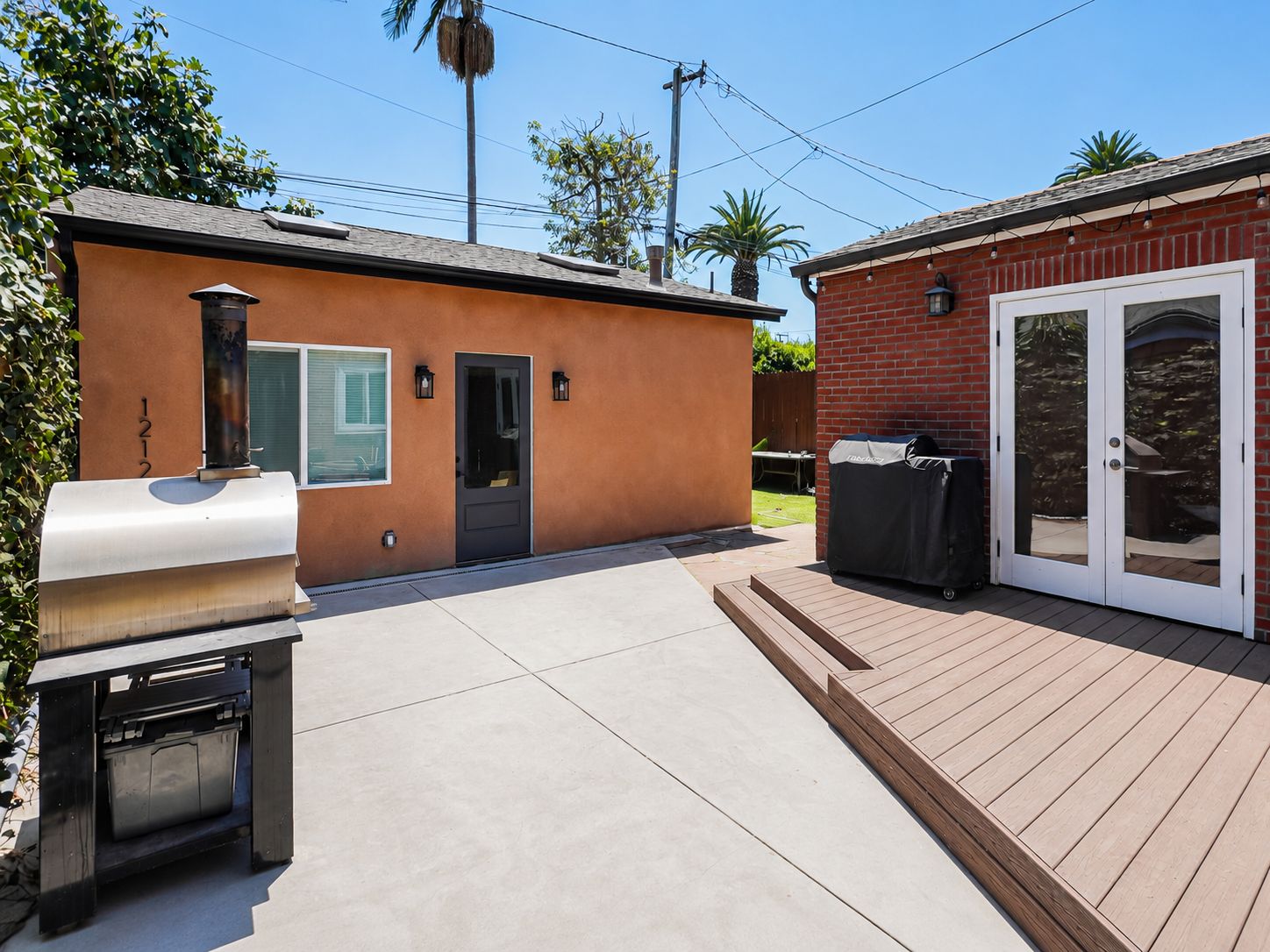Backyard patio and deck outside the finished conversion