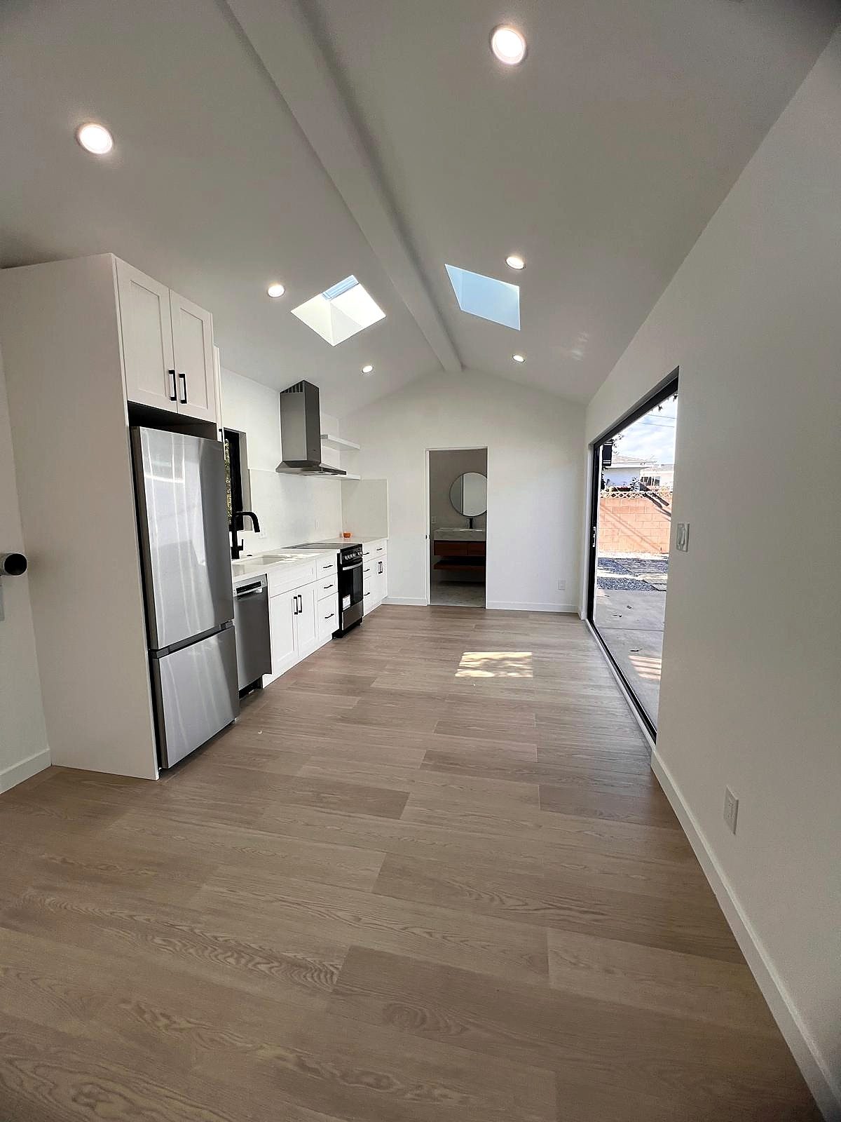 Finished kitchen with vaulted ceiling and dual skylights