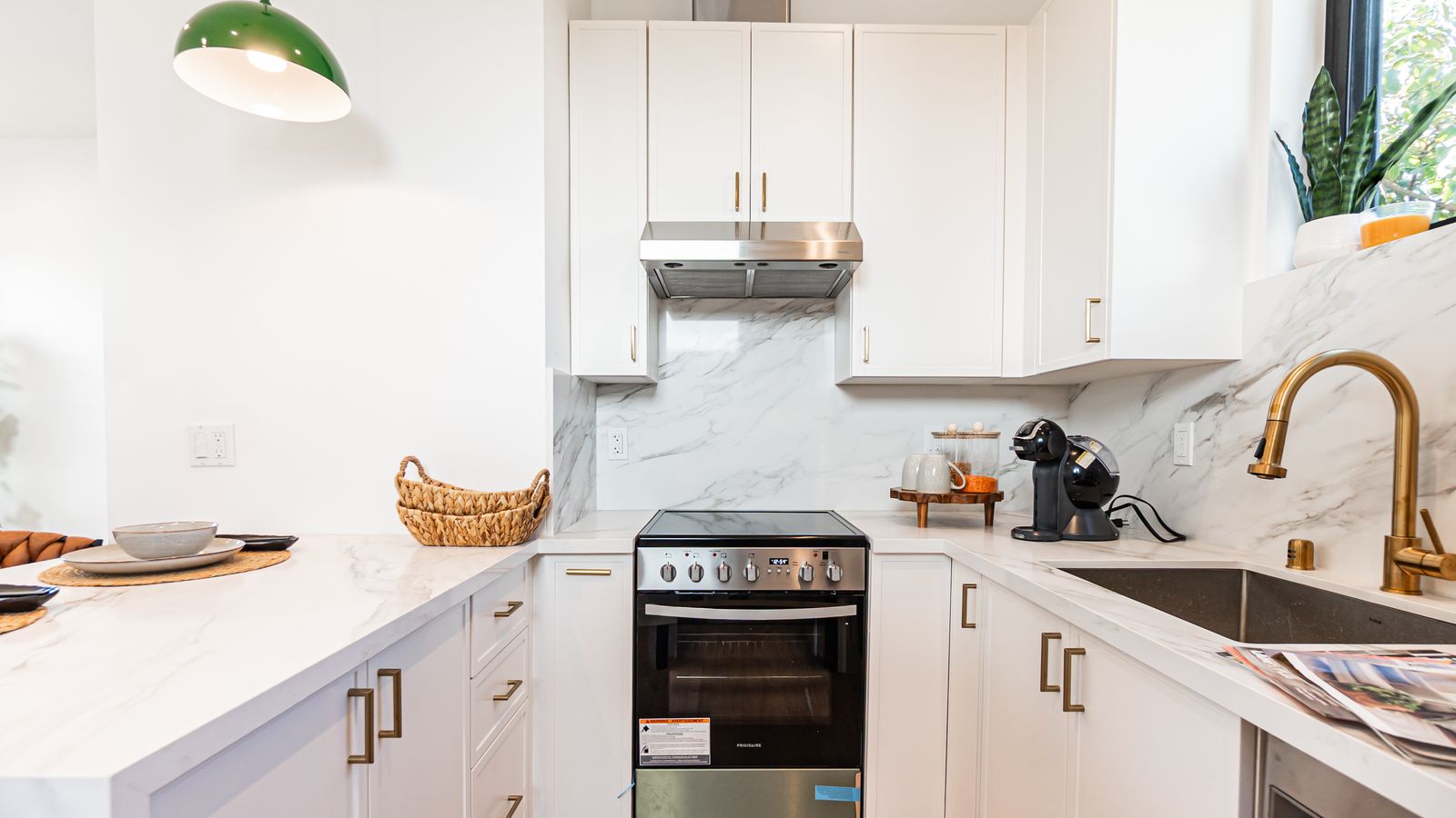 Kitchen stove and sink with gold fixtures