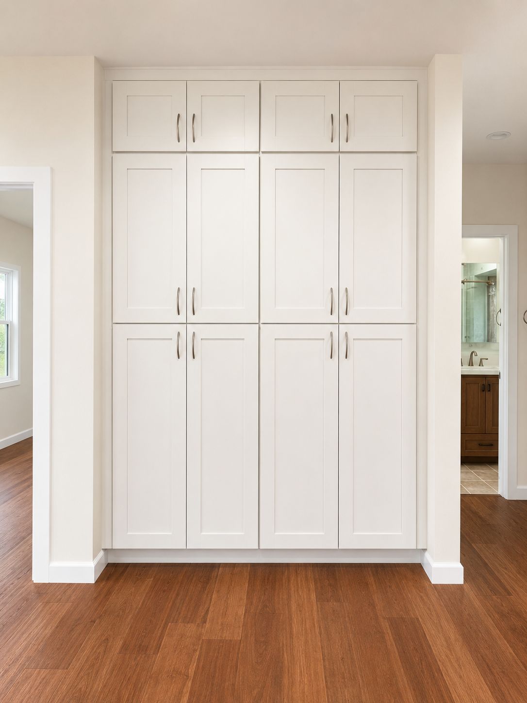 Floor-to-ceiling pantry cabinetry with brushed nickel pulls