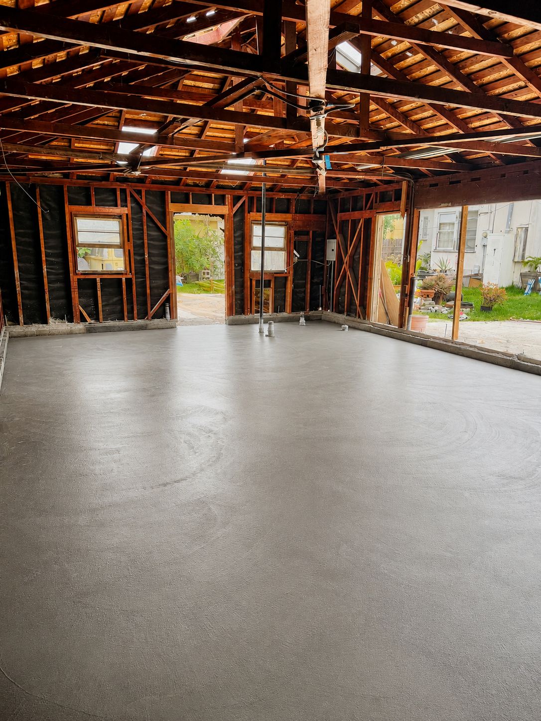 New concrete floor poured during the framing stage