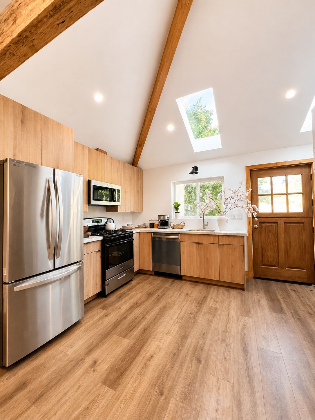 Kitchen with wood dutch door and vaulted ceiling